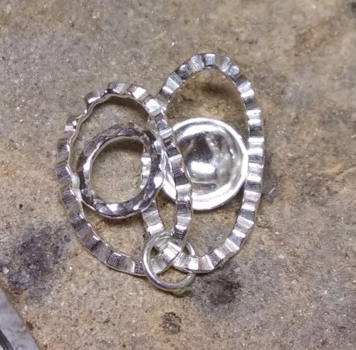 Judy Larson's Ripple Bracelet  - , Metalwork, Cutting, Cutting Tool, Cutters, Dapping, Dapping Jewelry, Filing, Finishing, Findings, Clasps, Components, Tumbling, Tumble, Tumbling Jewelry, Butane Torch, Soldering, Solder, Tools, Lay the links out in the desired order.